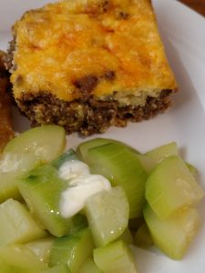 Low Carb Taco Pie on plate with zucchini