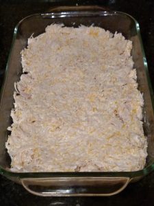 chicken and cheeses mixed in casserole dish