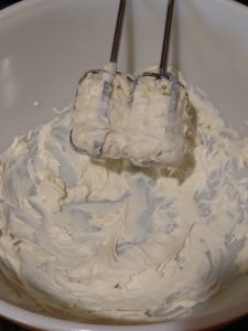 mixing cream cheese and butter in bowl