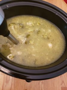 Crock Pot Broccoli Cauliflower Cheese Soup as it is being blended