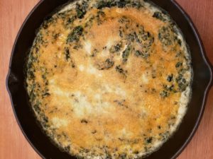 Creamy Spinach Cheese Bake in cast iron skillet