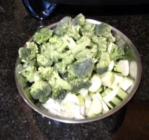 cut up vegetables in a silver bowl