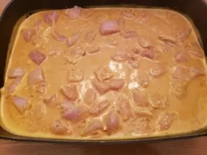 chicken and curry sauce in skillet