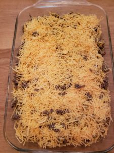 shredded cheese spread over top