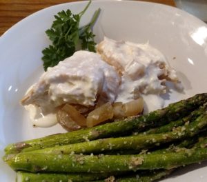 Low Carb Crock Pot Chicken & Cream Cheese Sauce with asparagus on plate