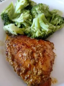 Coconut Buttermilk Southwestern Chicken next to broccoli on a white plate