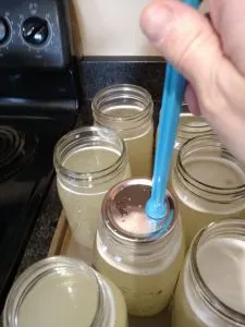 putting lid on jar