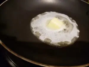 butter melting in frying pan