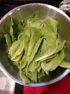 lettuce leaves in stainless steel bowl.