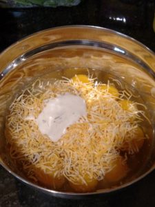 eggs, cheese, seasonings and ranch dressing in mixing bowl
