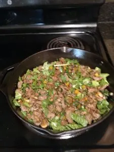 meat and vegetables in skillet