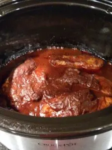 BBQ sauce in crock pot with chicken