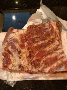 pork belly with seasonings rubbed into it