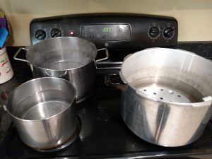 canner and 2 large pots of water on stove.