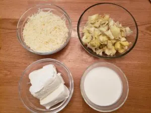 artichokes, cheeses and cream in bowls