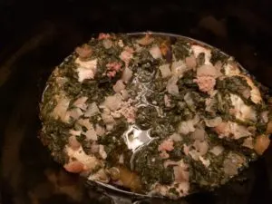 chicken, onion, spinach and broth in crock pot after cooking