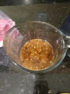 liquid ingredients in measuring cup for Crock Pot Beef and Broccoli Freezer Meal