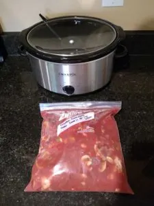 Freezer Chicken Cacciatore in Ziploc bag next to crock pot