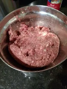 Ingredients for Low Carb Crock Pot Meatballs mixed together in a bowl