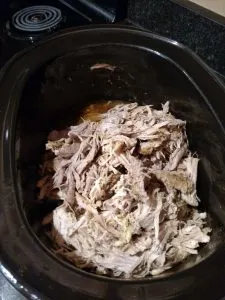Easy Tender Pulled Pork still in the crock pot after cooking