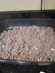 ground beef cooking in large electric skillet