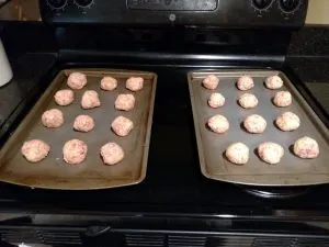 ingredients for Low Carb Gluten Free Sausage Balls in balls on baking sheets
