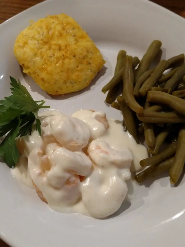 Low Carb Garlic Cheese Biscuits on plate with green beans and shrimp covered with alfredo sauce
