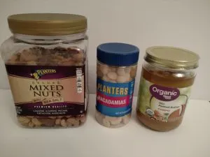 jar of mixed nuts, can of macadamia nuts and jar of peanut butter.