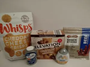 whisps cheese crisps, elevation bars, beef snack sticks, 2 types of electrolyte drops for water.