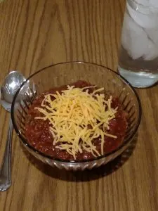 Low Carb Crock Pot Chili in bowl with cheese on top ready to eat