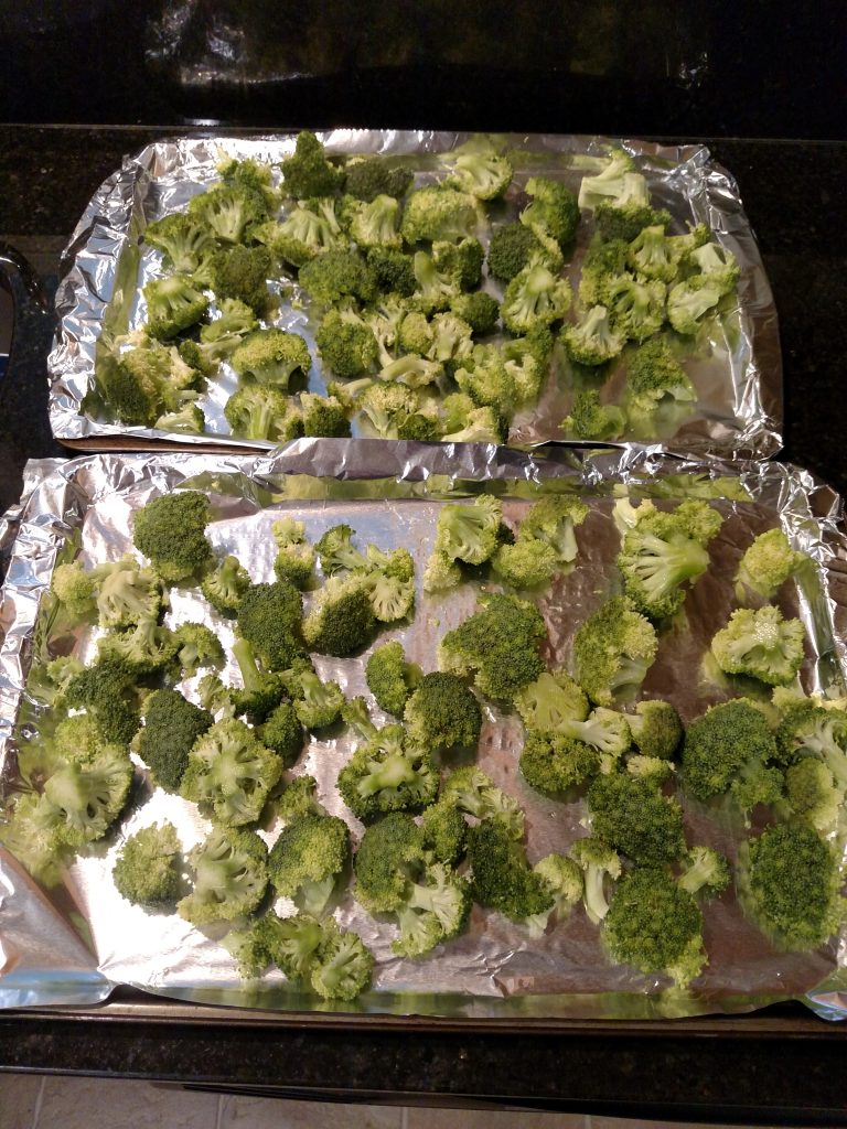 broccoli on foil covered baking sheet