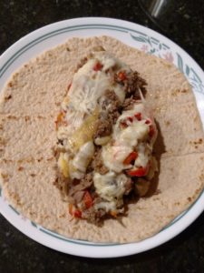 Keto Philly Cheesesteak Casserole on low carb wrap
