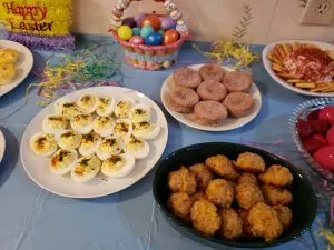 deviled eggs, sausage balls and cinnamon muffins on Easter buffet