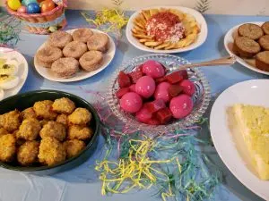 red beet eggs, sausage balls, cinnamon muffins and cheese ball and crackers on Easter buffet