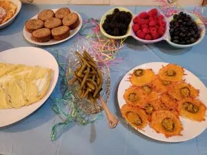 cheese crisps, pickled green beans, berries, cinnamon muffins and danish on Easter buffet