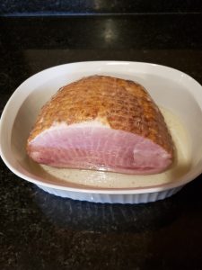 ham in white baking dish