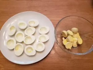 egg whites on a plate and yolks in a bowl