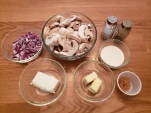 ingredients for Creamed Mushrooms in individual bowls