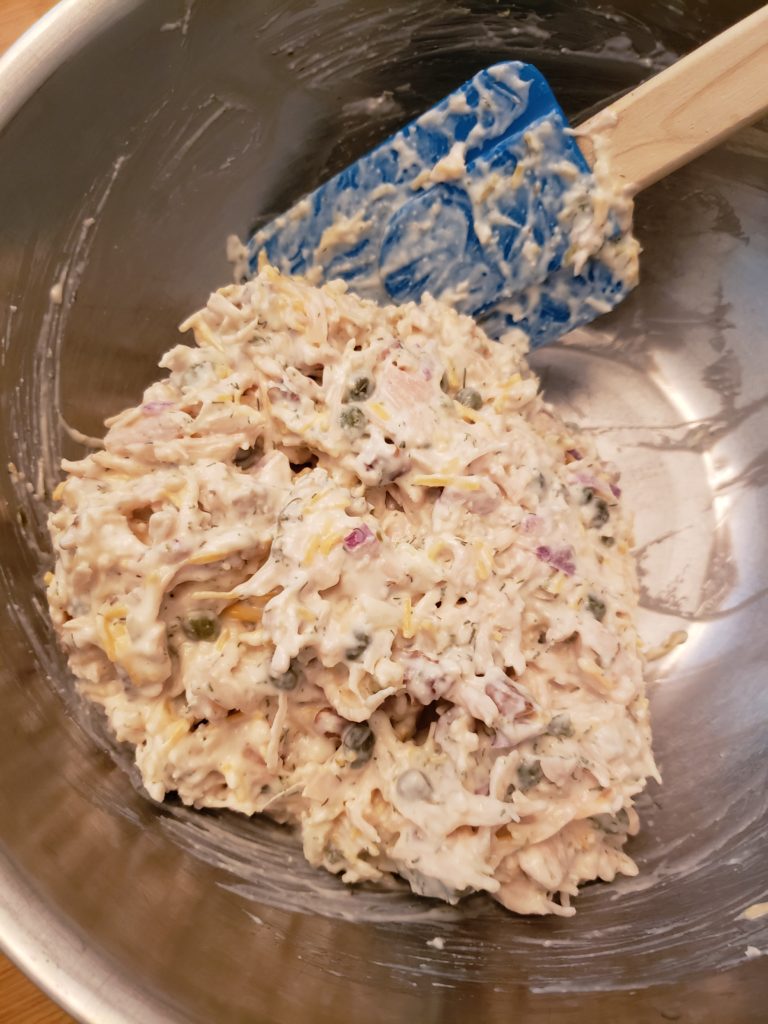 Deluxe Keto Chicken Salad being mixed in bowl