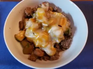 Keto Sausage Vegetable Breakfast Bowl with cheese on top