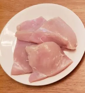 raw chicken on a plate