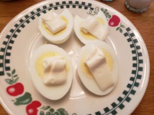 a squirt of mayo added to each half of egg