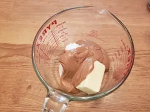 peanut butter and butter in measuring bowl