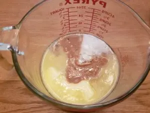 peanut butter and butter melted in measuring bowl