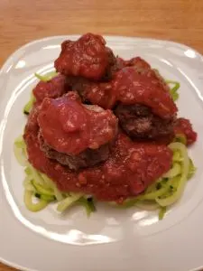 Keto Zoodles with Meatballs and Marinara Sauce before cheese is added