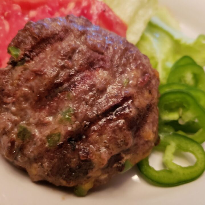 Low Carb Jalapeno Cheddar Burgers with tomato lettuce and jalapeno slices