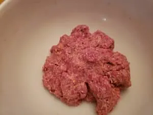 Low Carb BBQ Cheddar Burgers ingredients mixed in a bowl