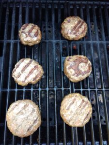 Low Carb BBQ Cheddar Burgers cooking on the grill