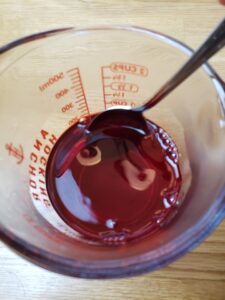 stirring red jello