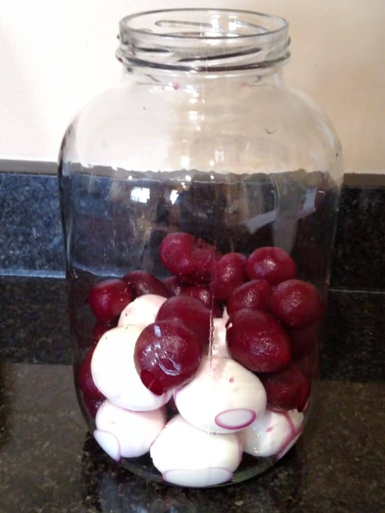 beets and eggs in large glass jar